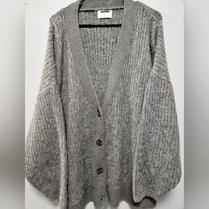 Grey knit plus size sweater with bell arms sleeves.
